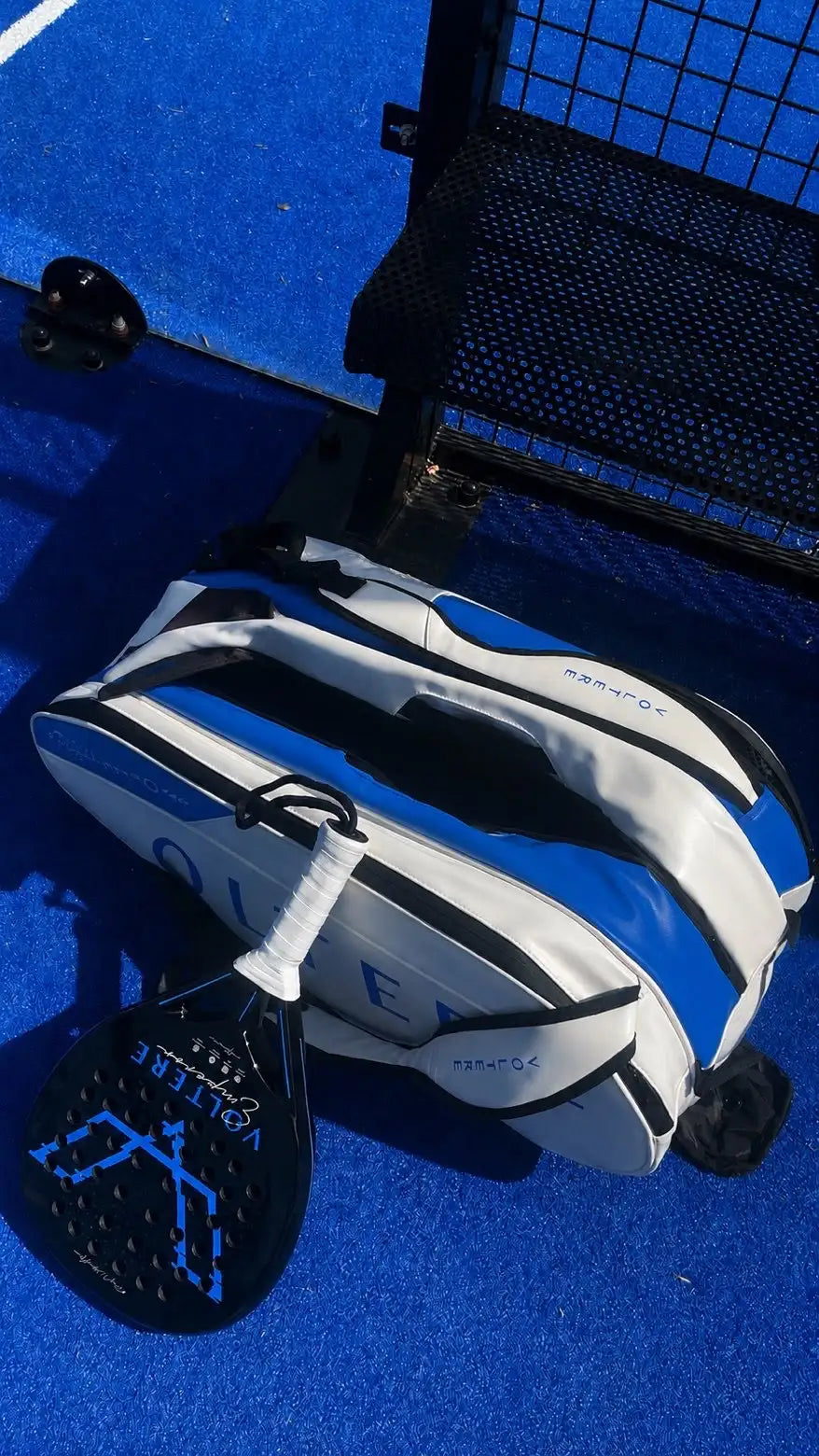 White and blue striped paddle tennis bag with black accents, featuring the ’queen’ brand name.